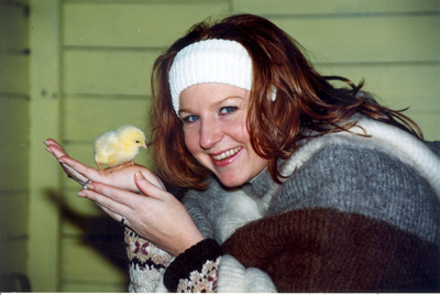 girl with baby chick